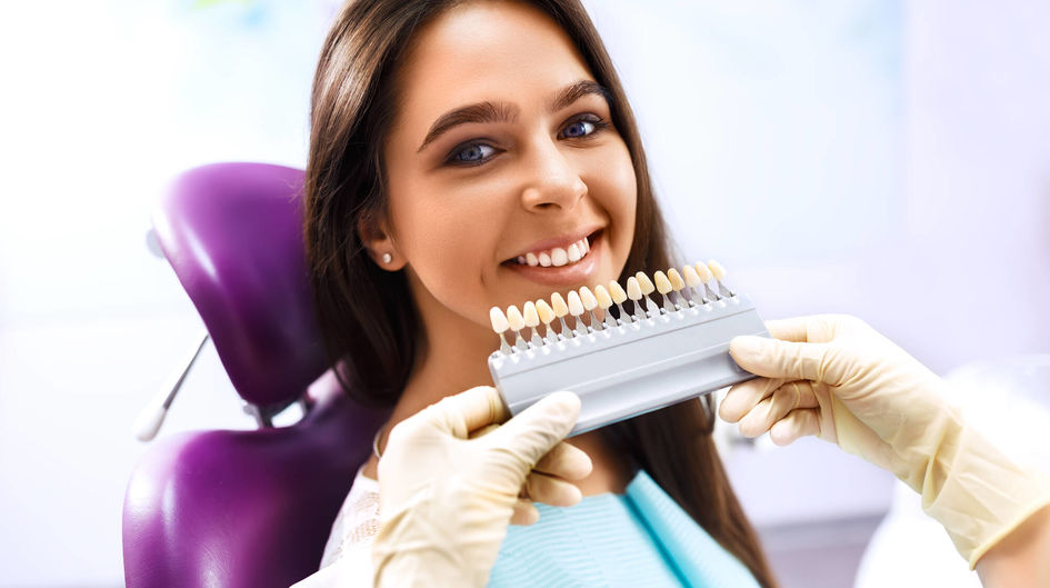 Smiling woman with artificial teeth