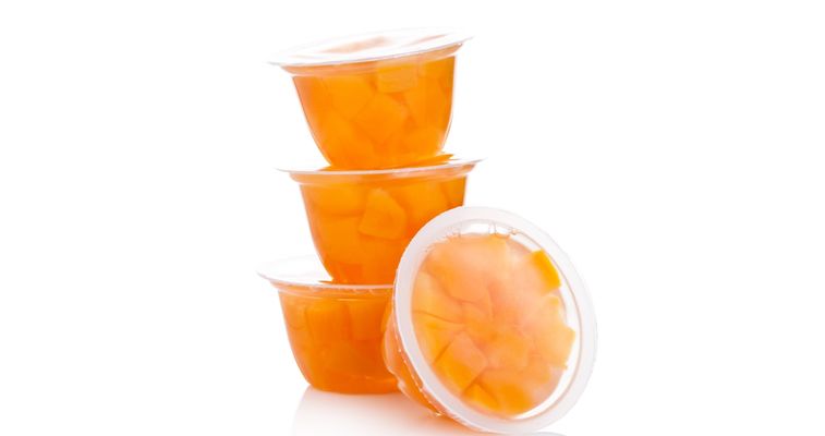 Peach pieces in plastic cups